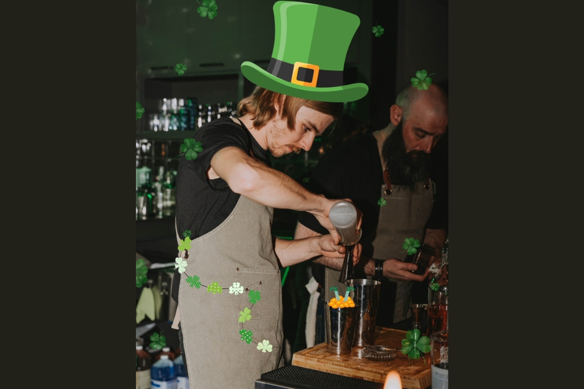 Bartender mixing a drink at a St. Patrick’s Day–themed trivia night, with green decorations and bar tools visible.