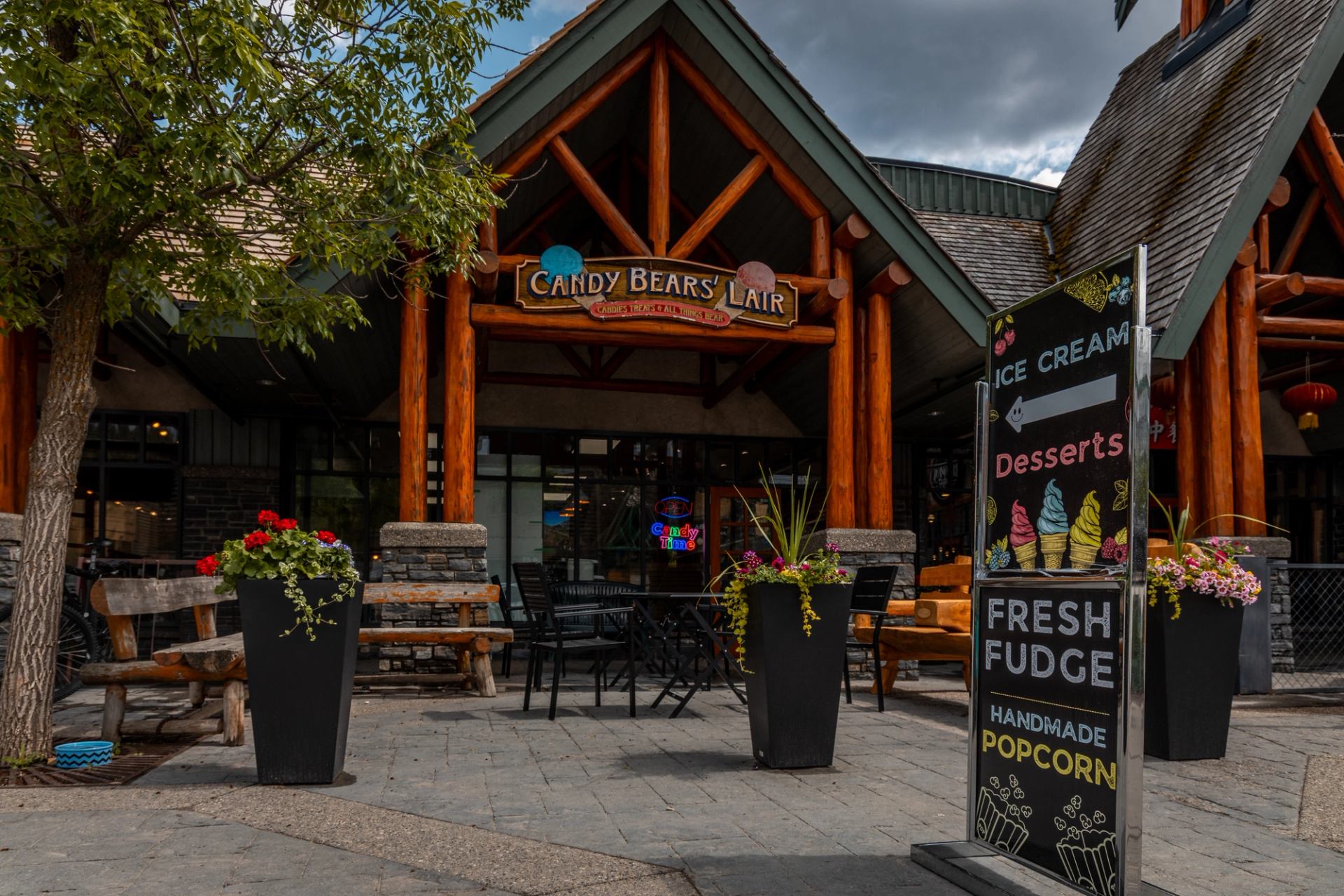 Candy Bear's Lair entrance with sign for ice cream, fudge, and desserts.