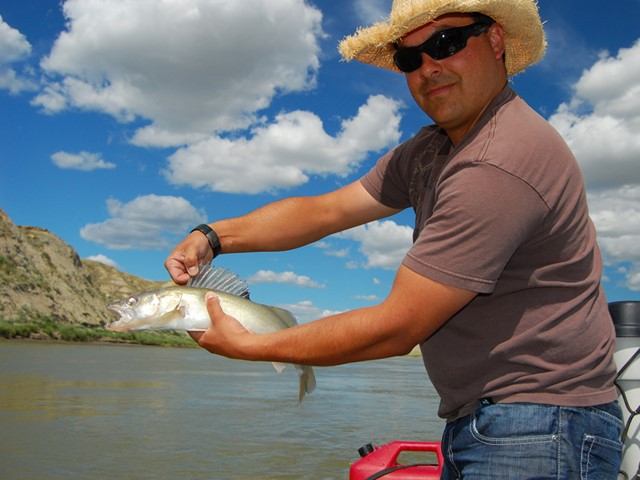 A man holding a fish.