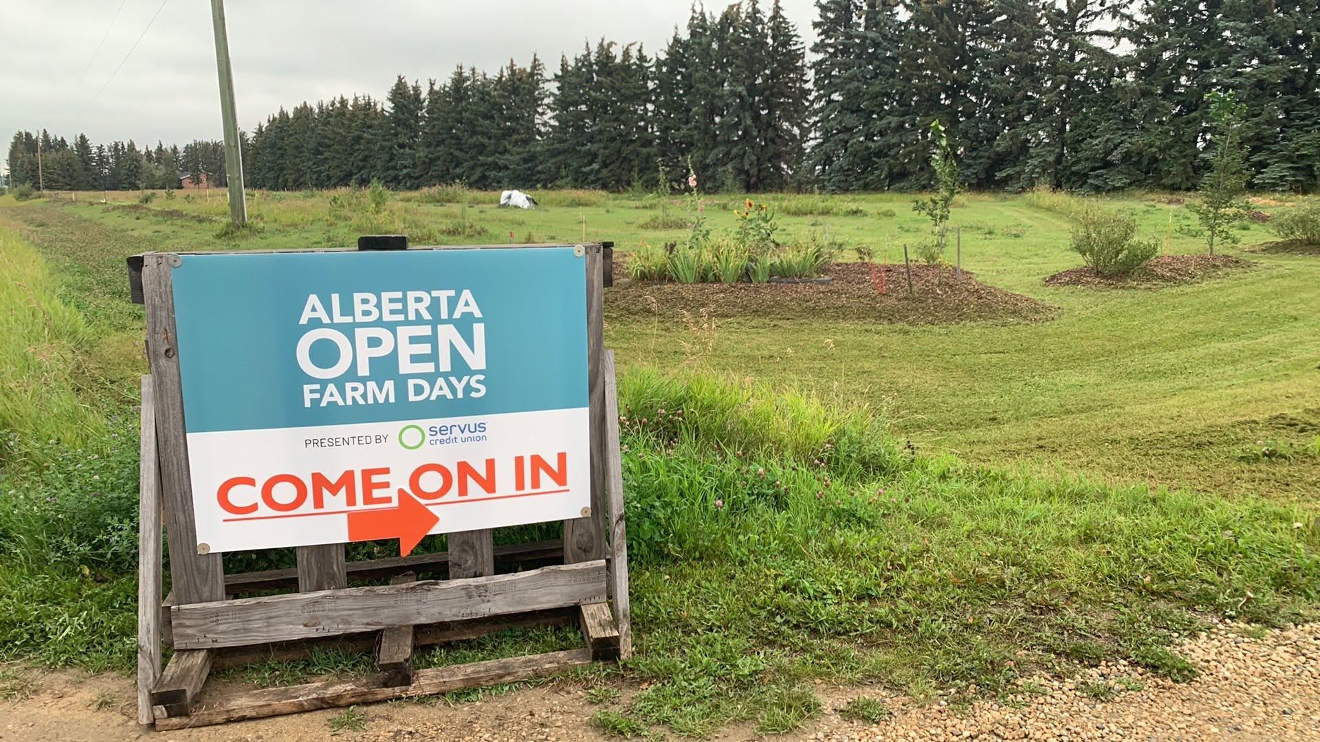 BFF Farm welcomes guests with an Alberta Open Farm Days sign at the farm entrance.