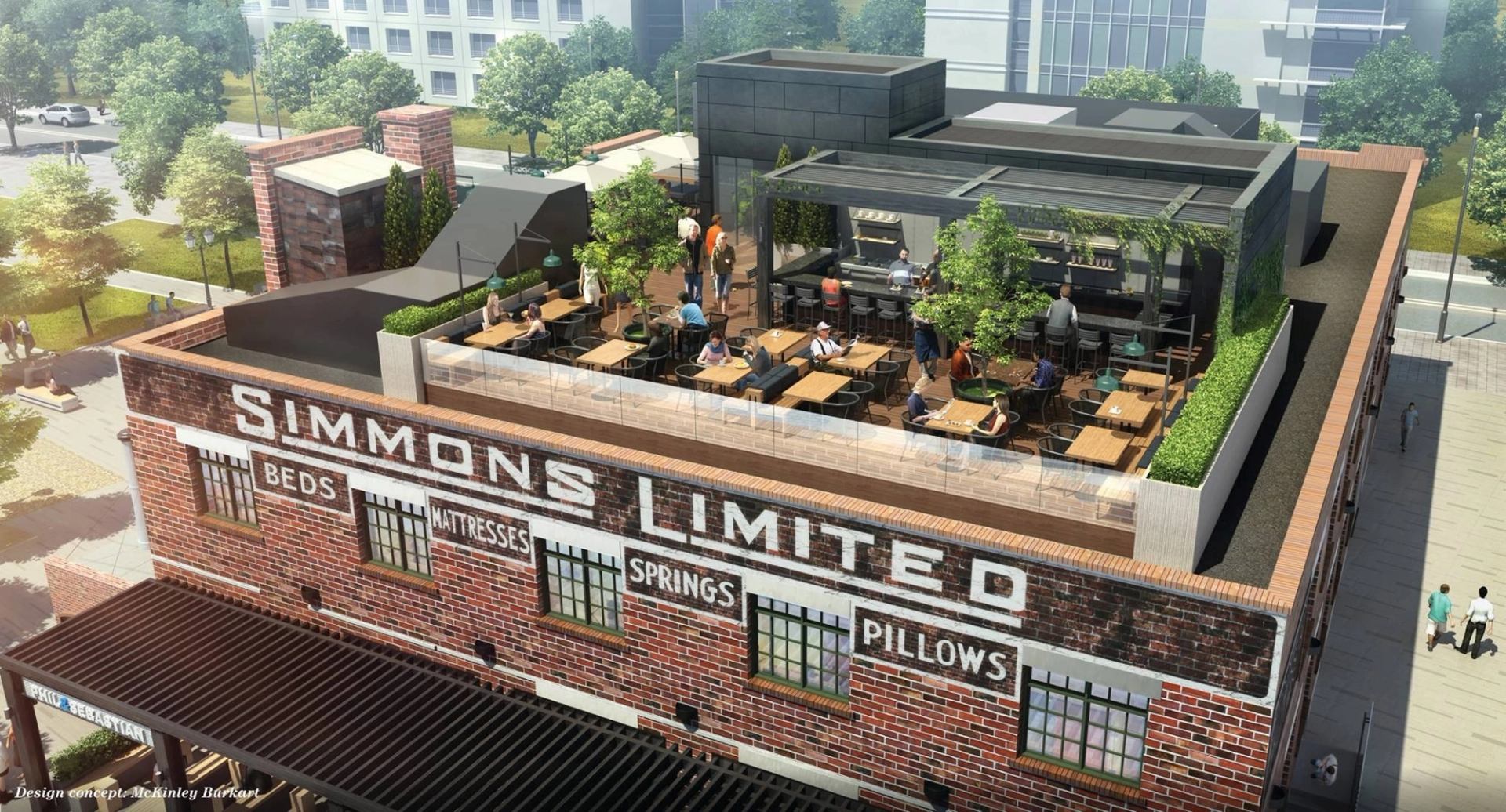 Rooftop patio with people seated at wooden tables, surrounded by greenery. Brick building with faded sign for "Simmons Limited" visible below.