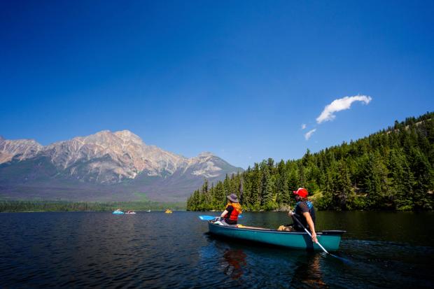 Couple in a canoe paddling in Pyramid Lake.