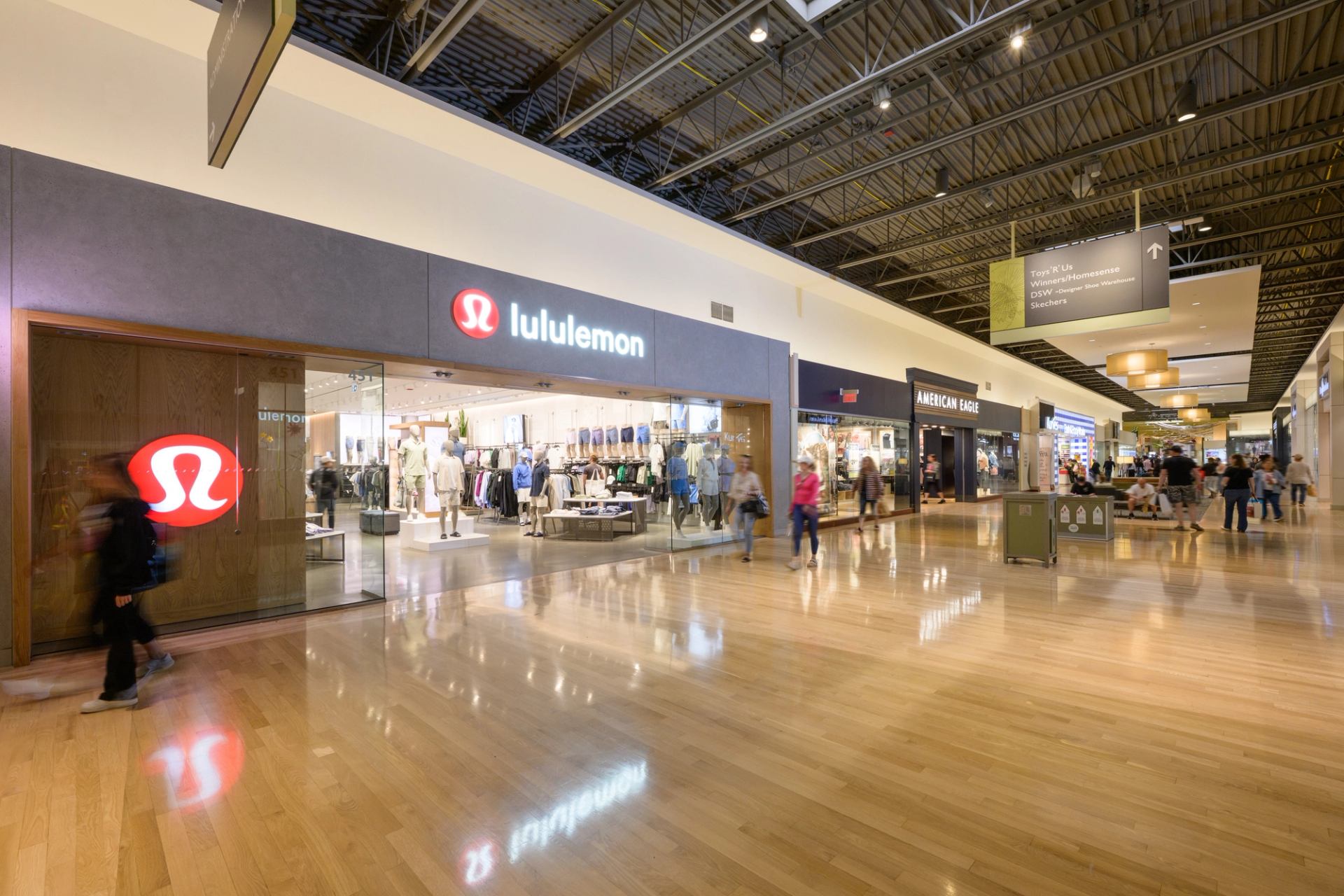 Lululemon storefront at CrossIron Mills with glass entrance and modern interior.