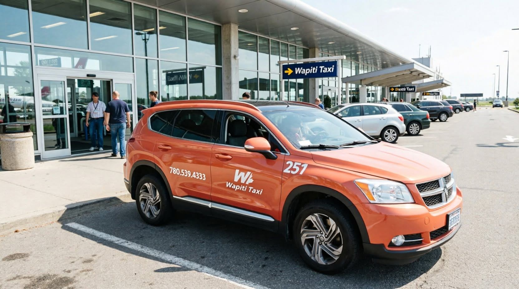 Orange Wapiti Taxi SUV parked outside a glass-fronted airport terminal.