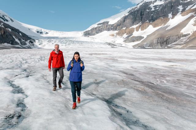 Couple walking on the Columbia Icefield.