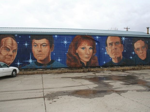 Mural of Star Trek cast on exterior wall in Vulcan.