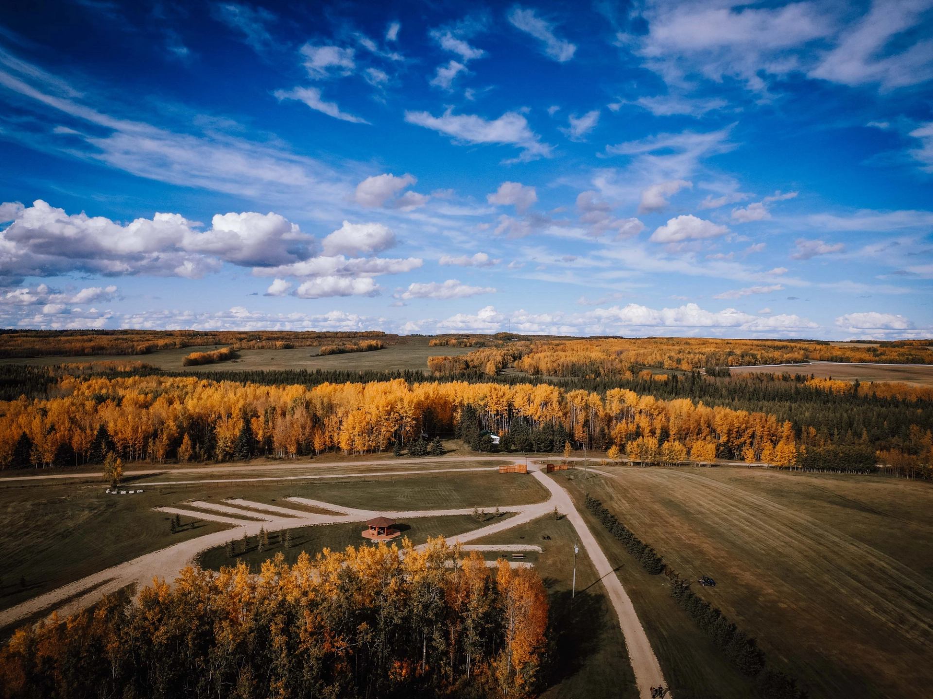 Aerial view of the campground in the fall with a blue sky.