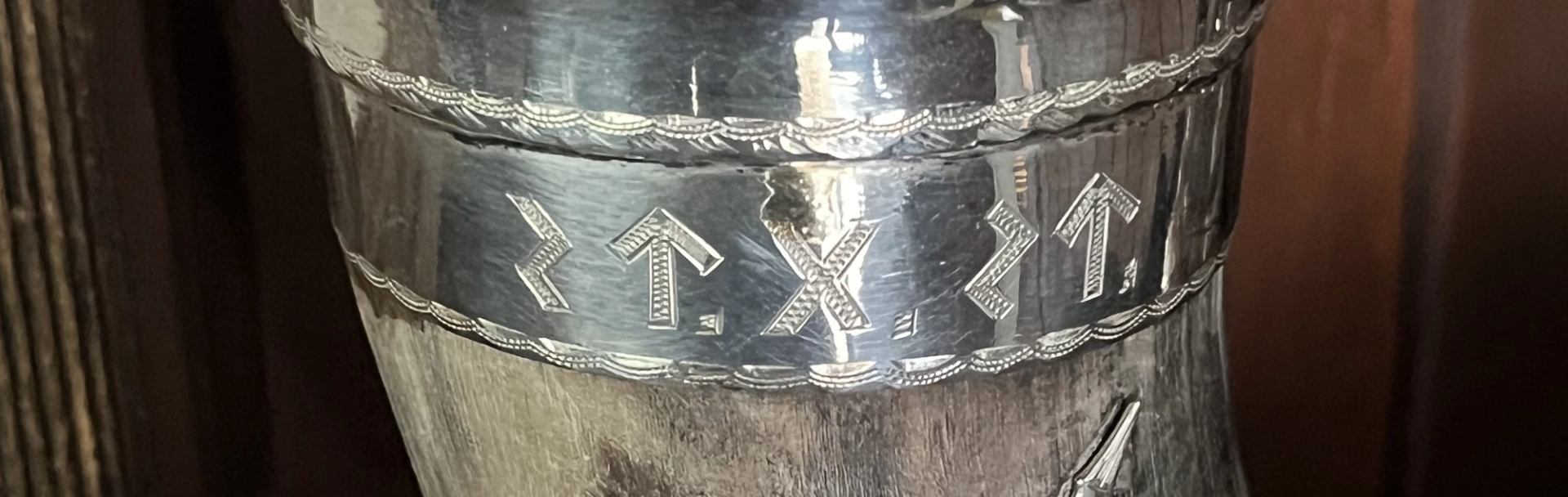 Runic writing on a metal pot.