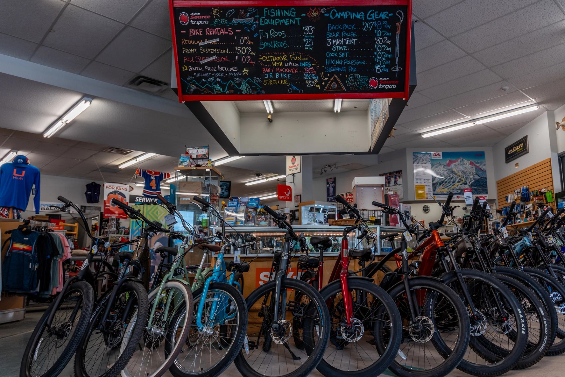 Inside Jasper Source for Sports with bikes and sports gear on display.
