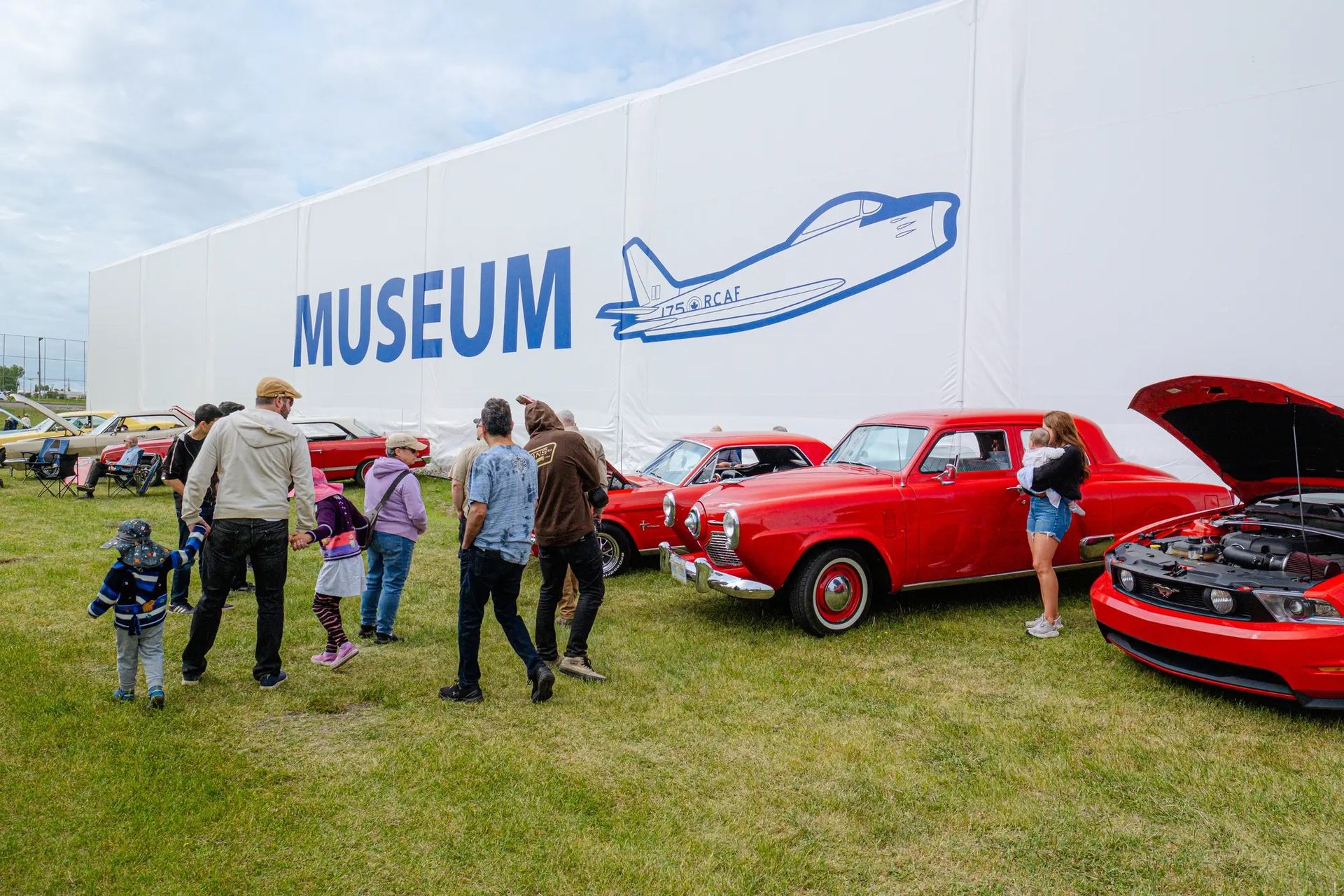 Families enjoying the Annual Wing and Wheels on Father's Day Weekend