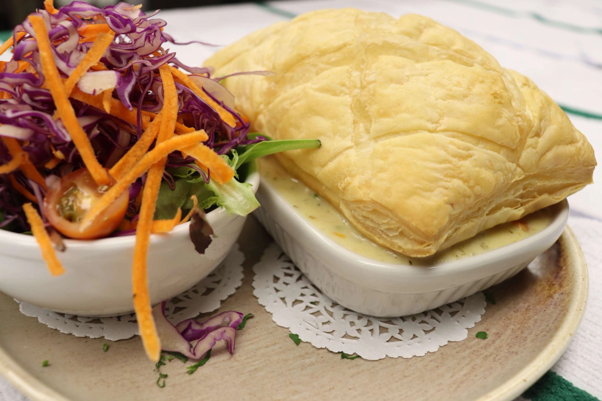 Flaky puff pastry served with creamy filling and a fresh salad of carrots and purple cabbage.