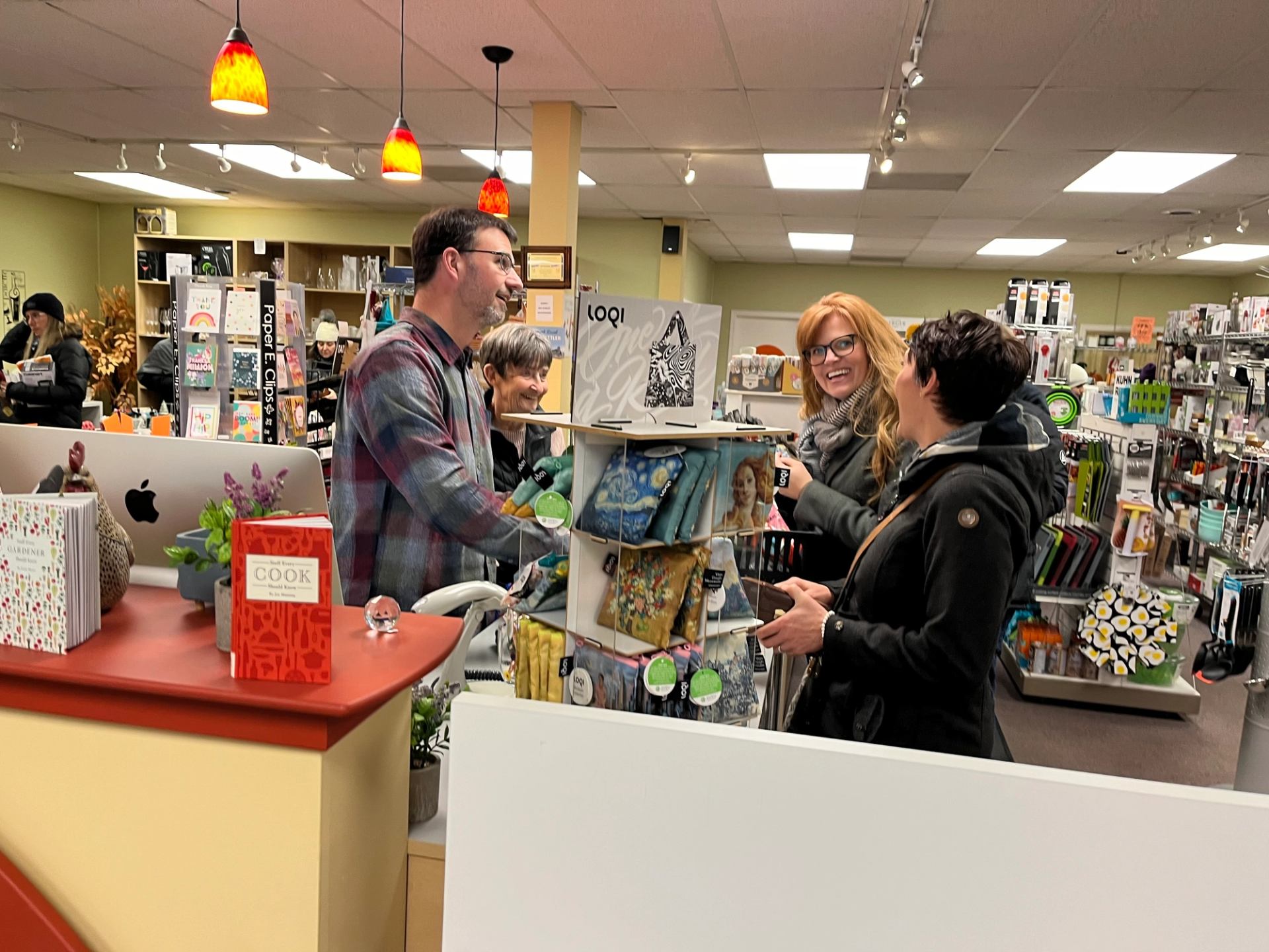 Customers enjoy a visit with shopkeeper at Grate Kitchen Shoppe