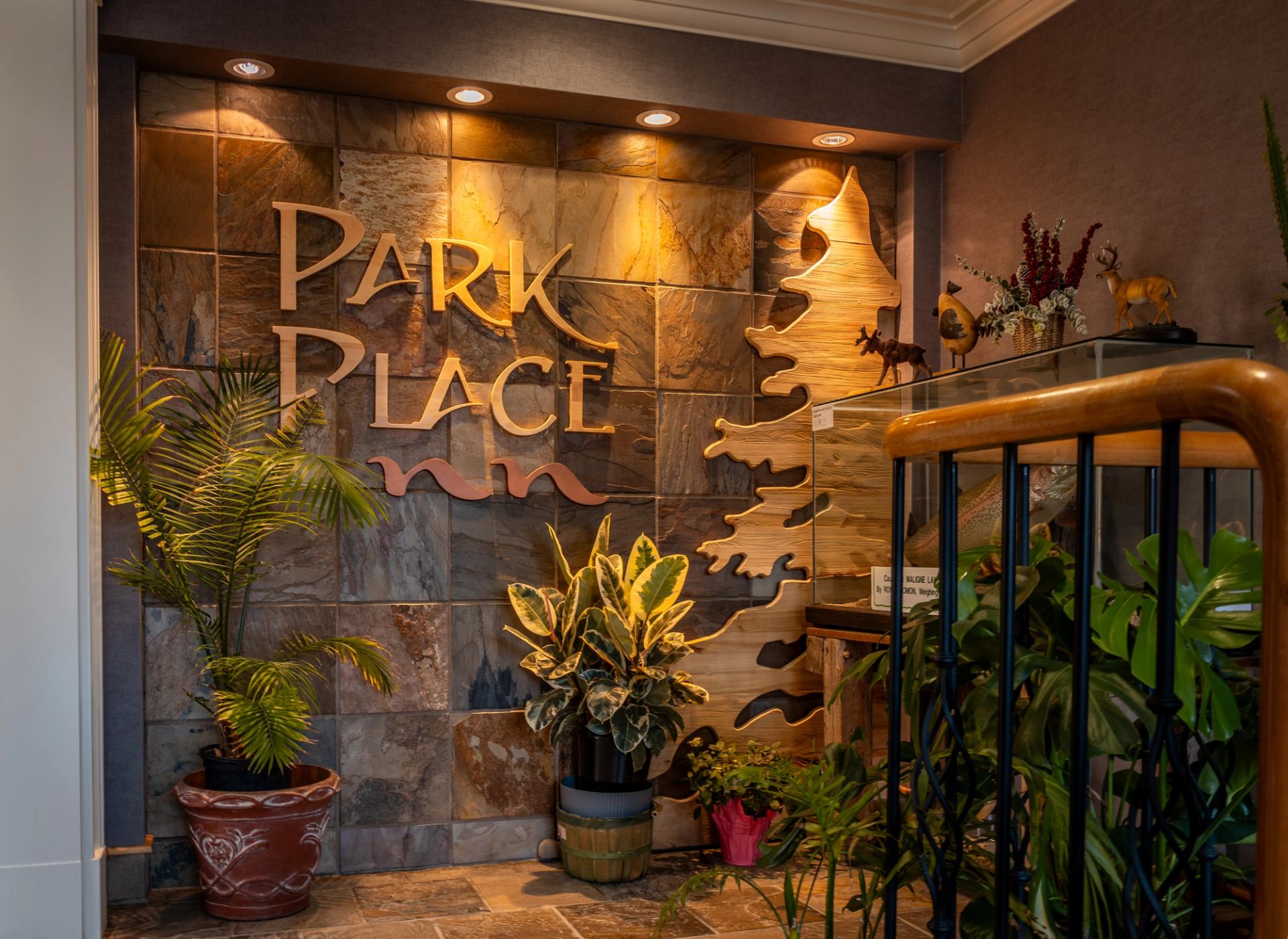 Park Place Inn entrance with greenery and warm lighting.