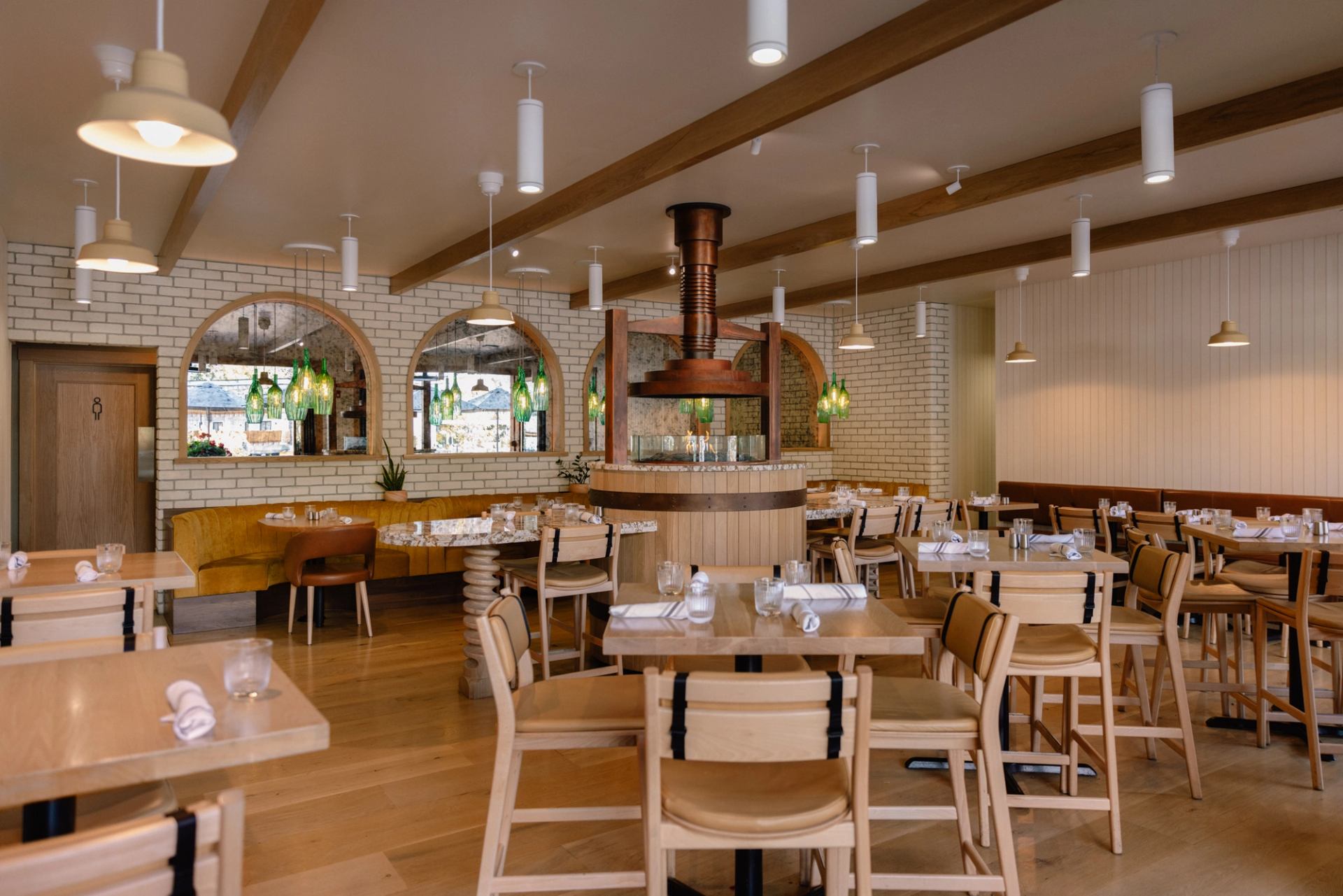 A wide view of the main dining room and fireplace at Sudden Sally