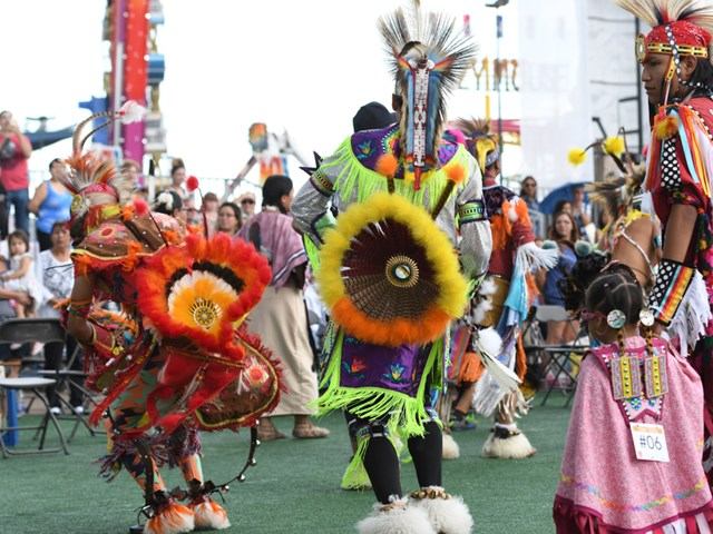 Dancers in colorful traditional outfits perform at K Days cultural celebration.