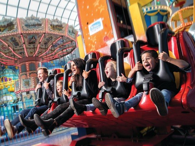 Family enjoying the rides at Galaxy Land at West Edmonton Mall.