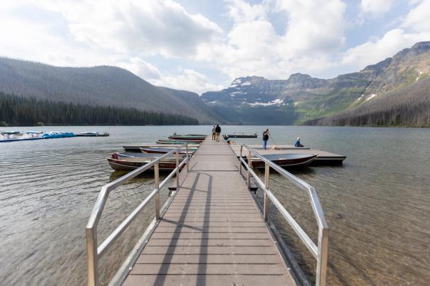 People walking on the accessible dock at Cameron Lake in Waterton Lakes National Park.