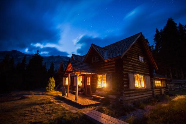 Exterior of Skoki Lodge at night in the Summer.