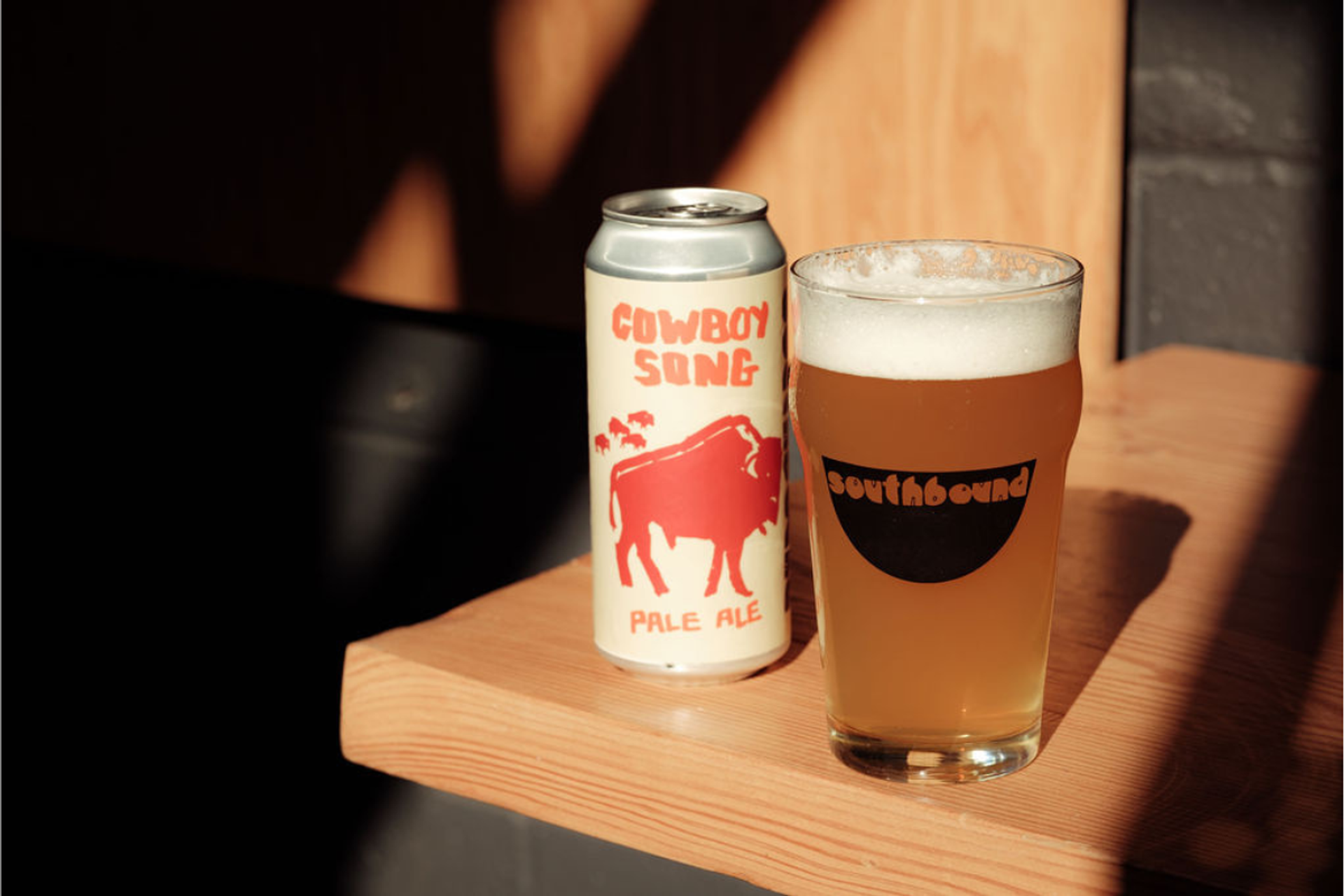 Cowboy Song Pale Ale can and glass served at hot sauce contest.