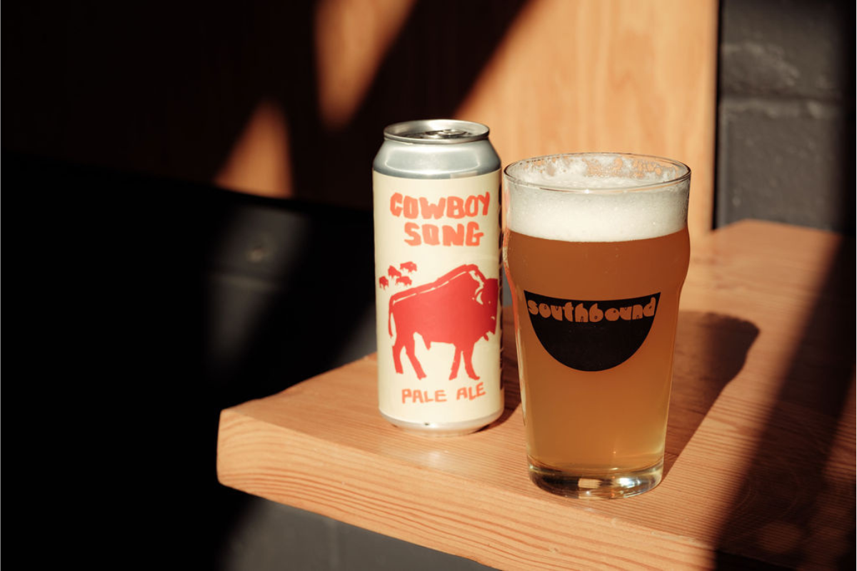 Cowboy Song Pale Ale can and glass served at hot sauce contest.