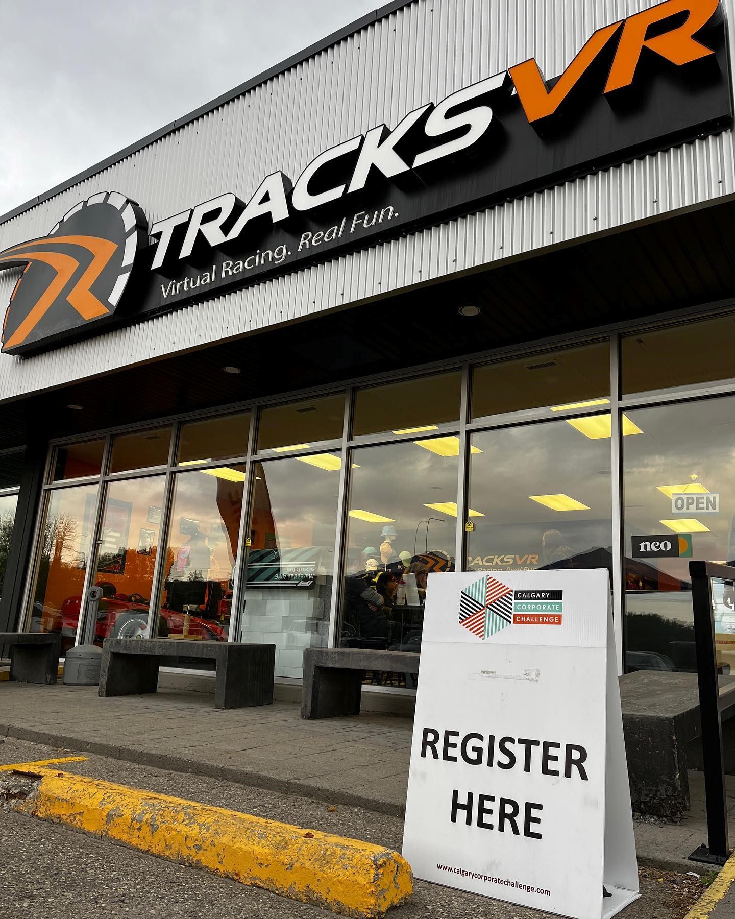 TracksVR storefront with signage and registration board outside.