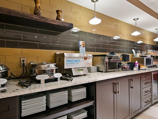 Breakfast counter with appliances and pancake station at Best Western Plus Red Deer.