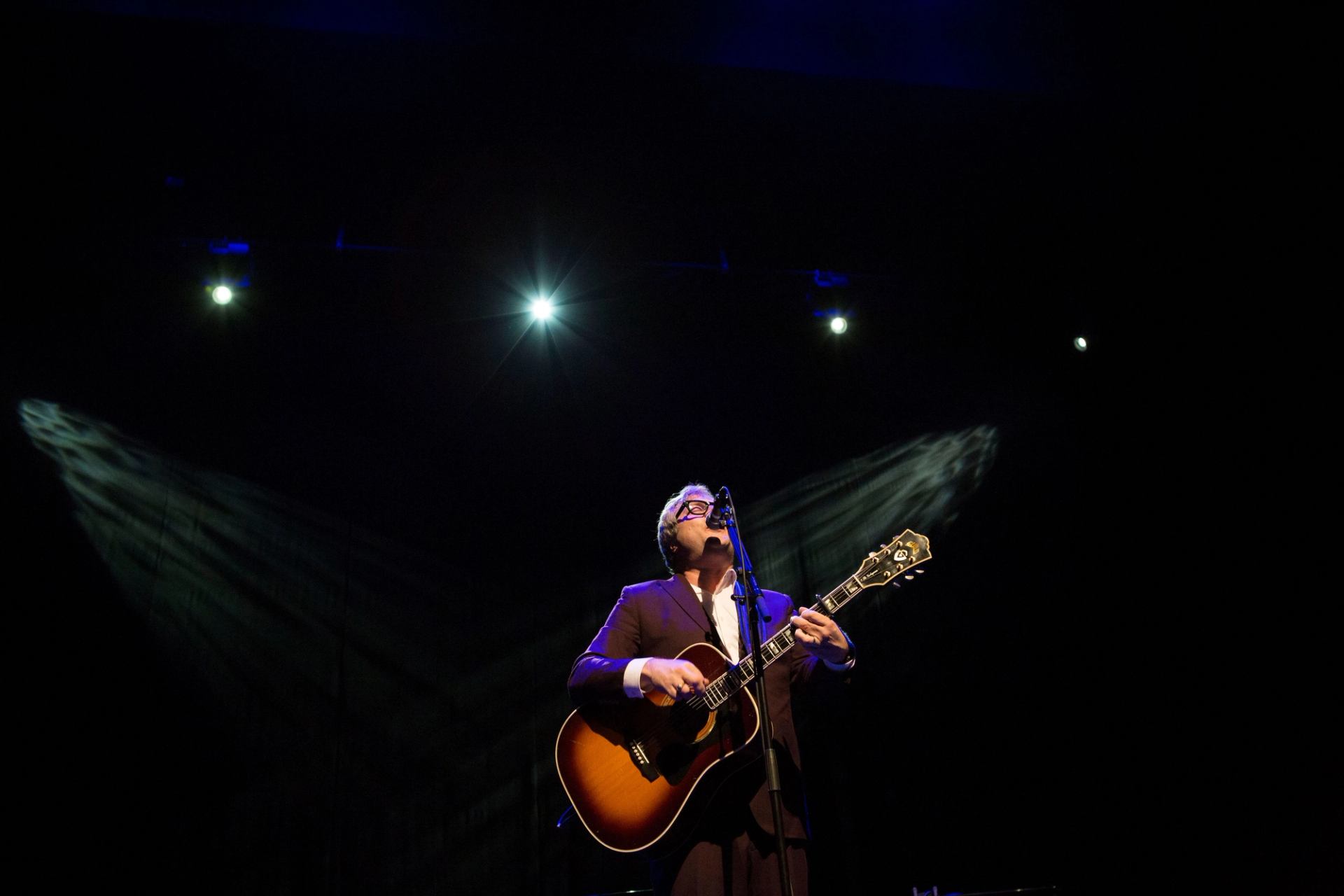 Steven page performing with a guitar