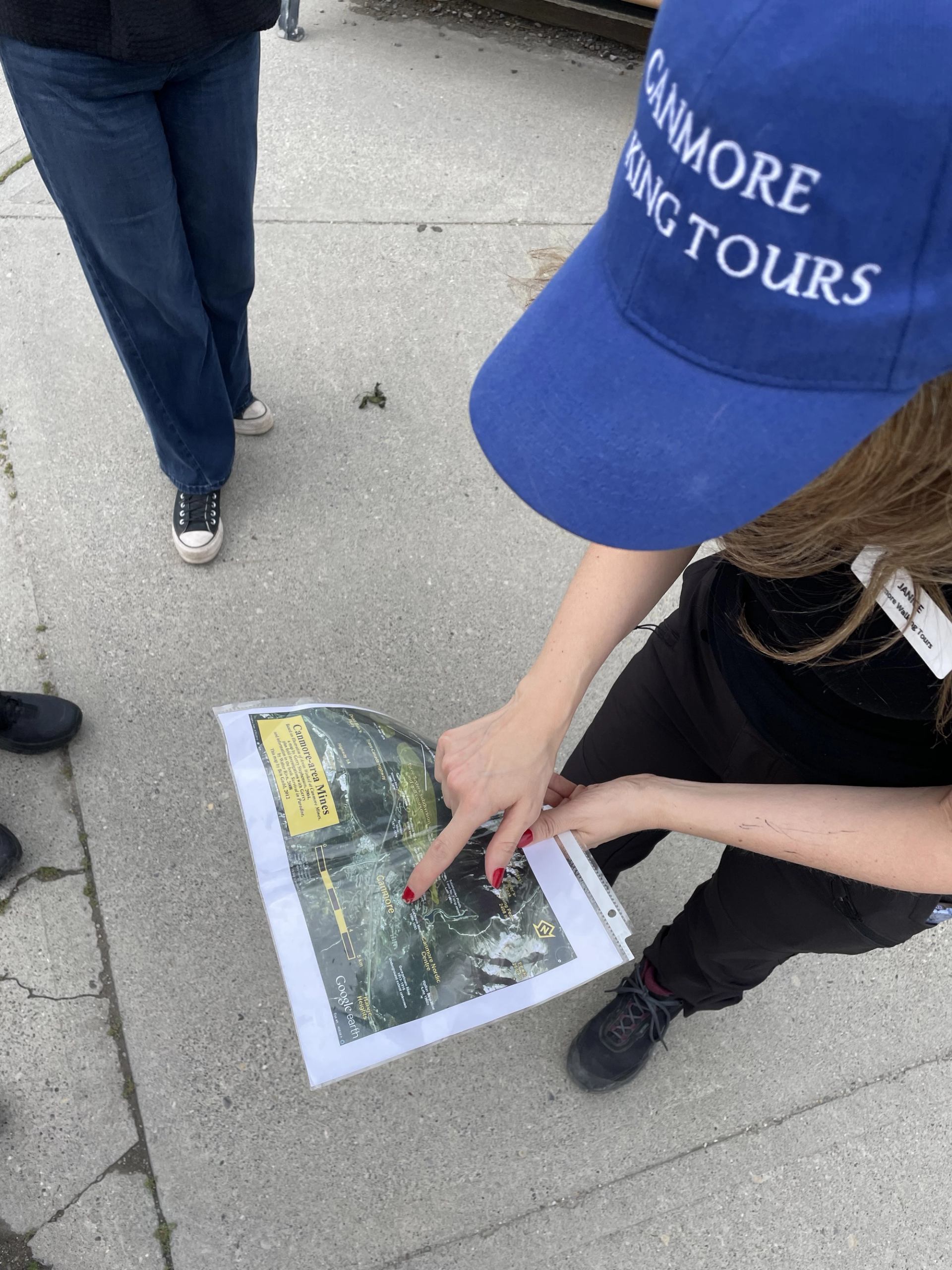 Walking tour guide shares information, history, and fun facts about charming mountain town, Canmore