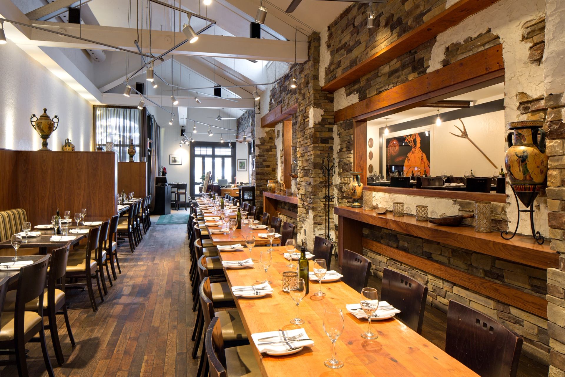 Restaurant interior with large tables suitable for groups and booth seating along the wall