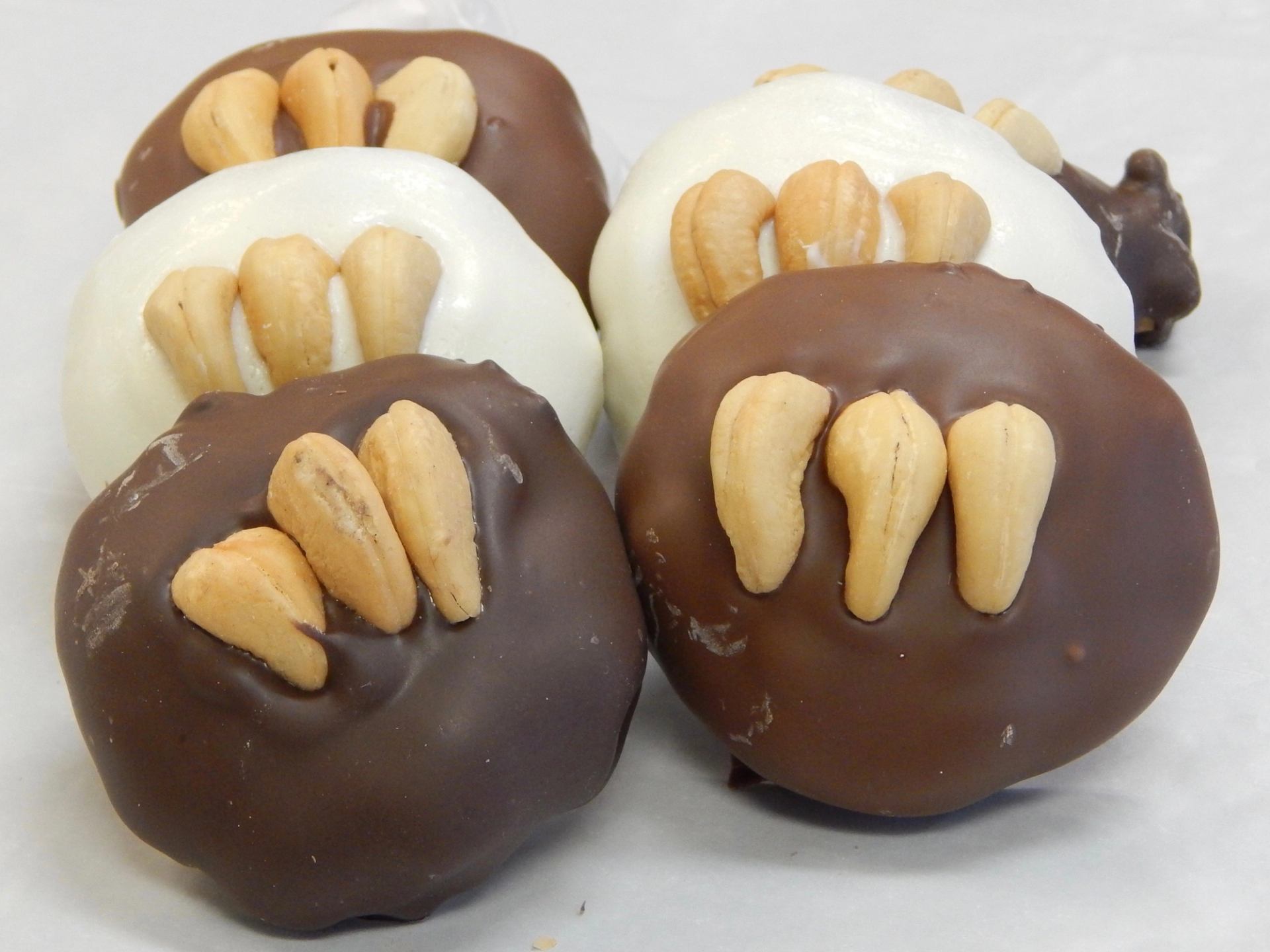 Chocolate and white chocolate bear paw candies with almond claws.