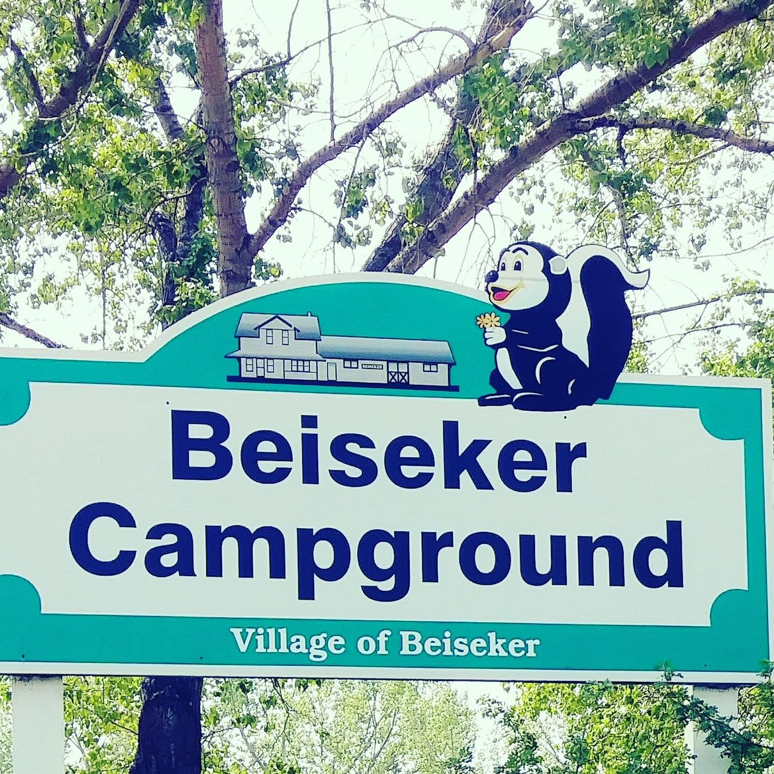 Beiseker Camprground sign with blue squirrel graphic and Village of Beiseker text.
