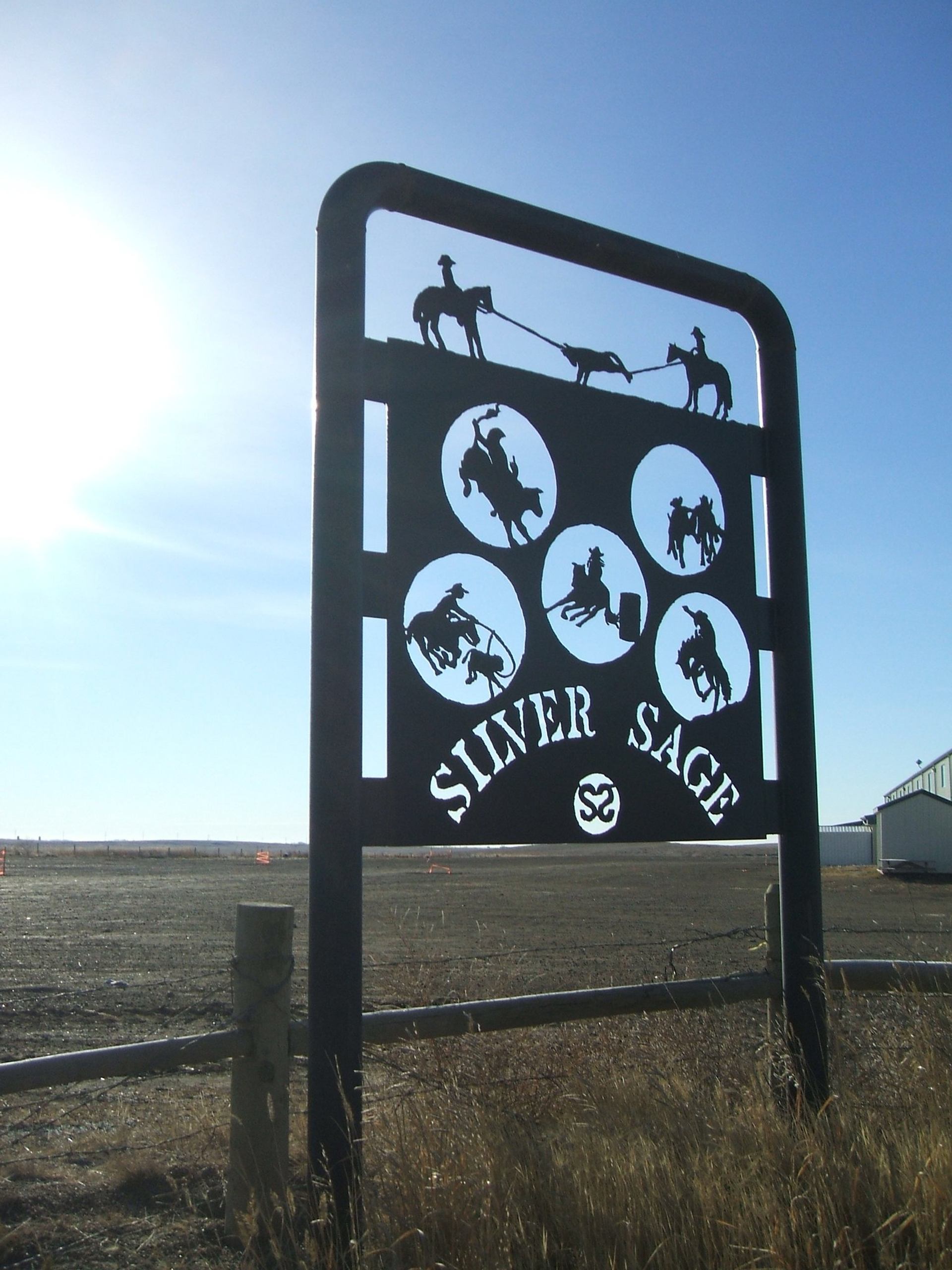 Silver Sage Agricultural Society features a large metal sign with cutout silhouettes