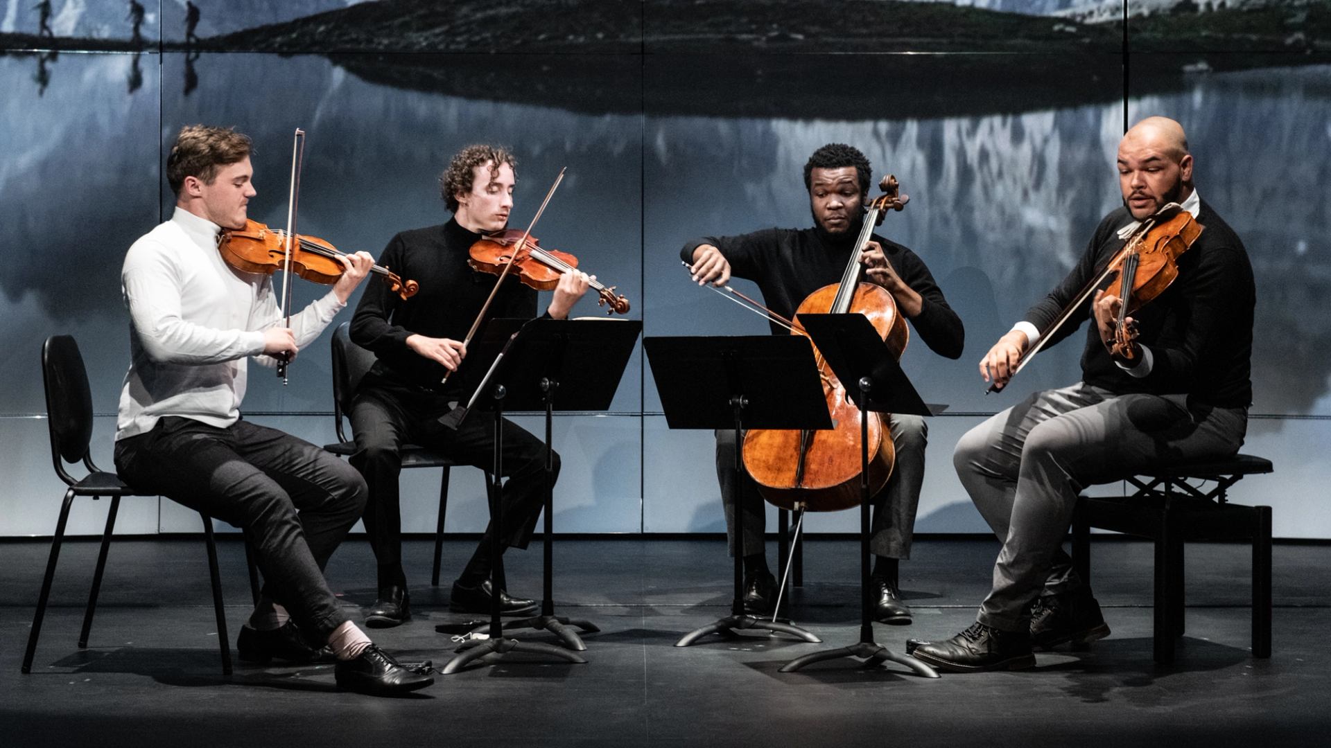 A string quartet performs on stage