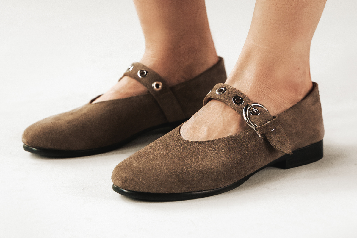 Brown suede Mary Janes with buckle strap, worn at Poppy Barley pop-up event.
