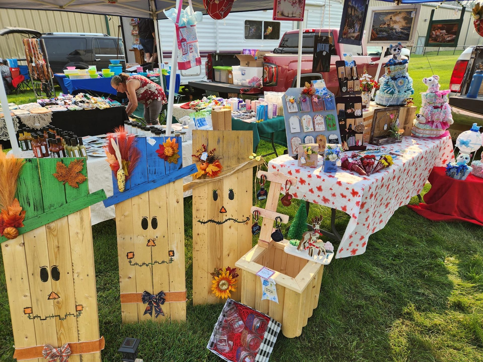 Colourful market stalls showcase handmade crafts, gifts, artwork, preserves, and locally made products.