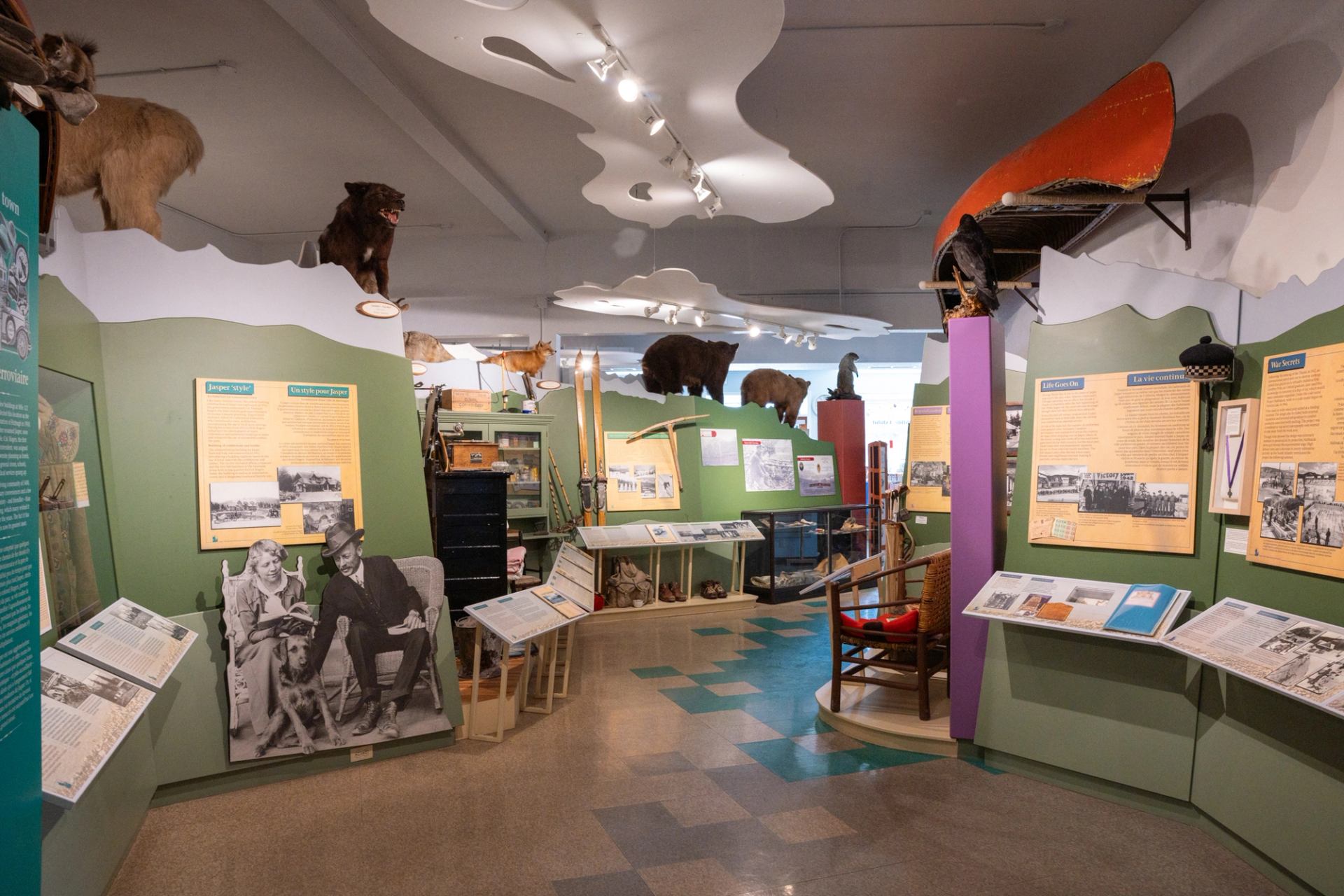  Interior of Jasper Yellowhead Museum with exhibits, artifacts, and mounted animals.