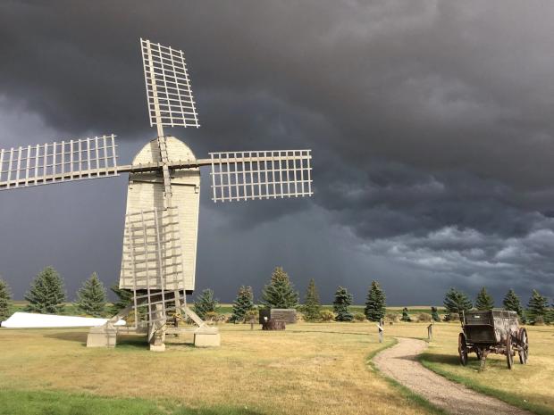 The windmill site with a stormy sky in the background.