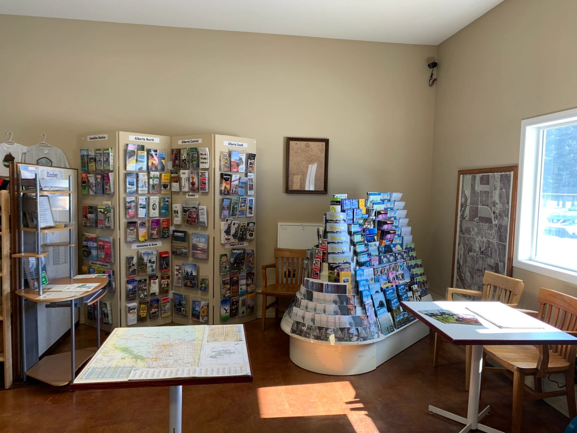 Brochures and maps displayed at a visitor info station
