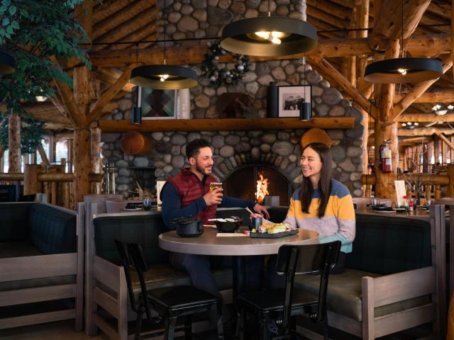 A couple enjoying a sushi dinner at Kuma Yama at Lake Louise Ski Resort in Banff National Park