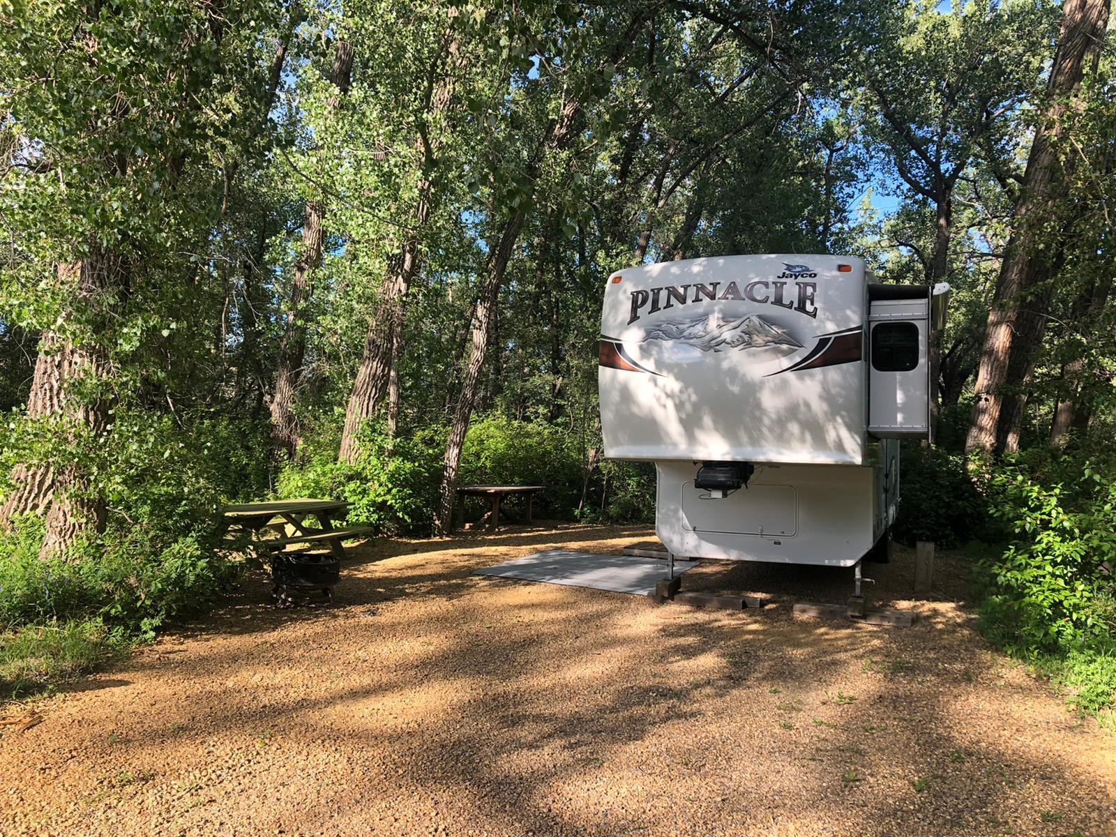 RV parked at campsite at Badlands Campground.