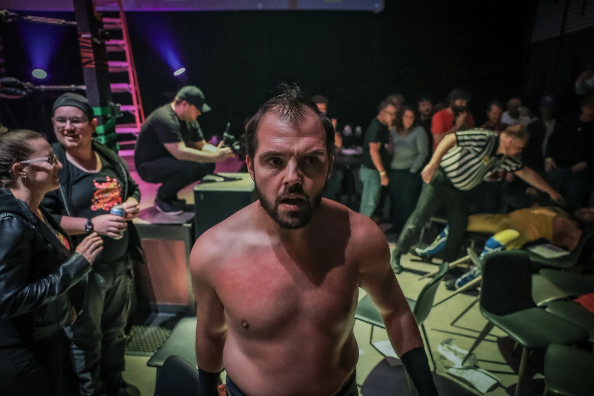 Wrestler near audience area with fans and crew after Love Pro Wrestling 44 match
