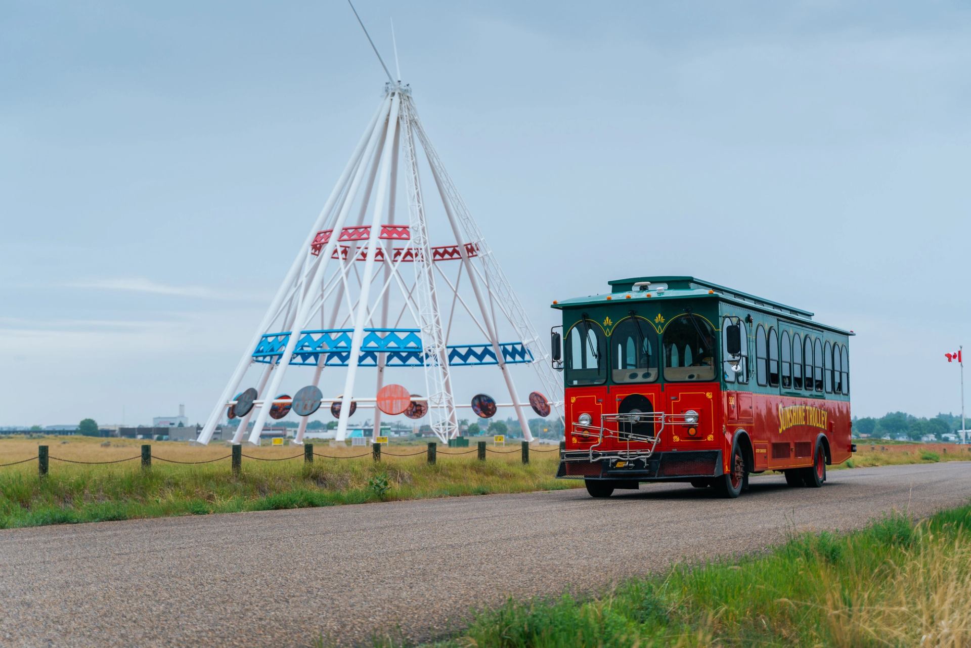 Medicine Hat Sunshine Trolly driving past the World’s Tallest Saamis Tepee