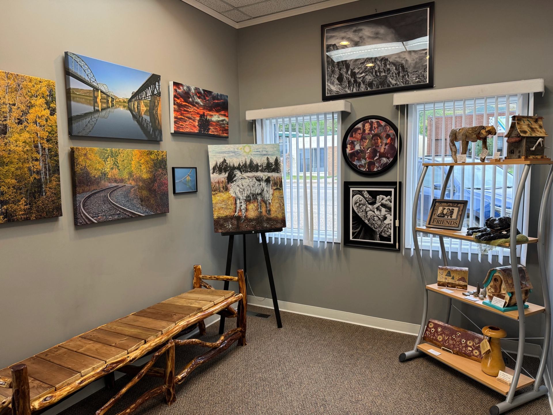 Artworks and sculptures displayed in Peace River Art Club gallery room.