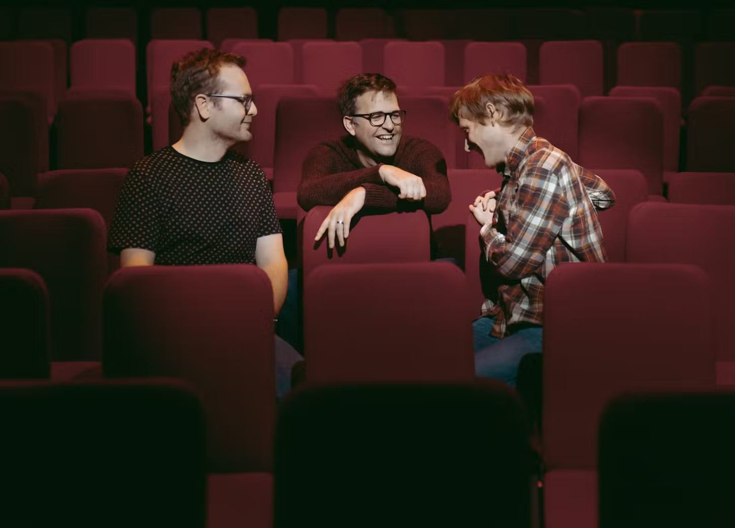 The Young’uns sat in red theatre seats.