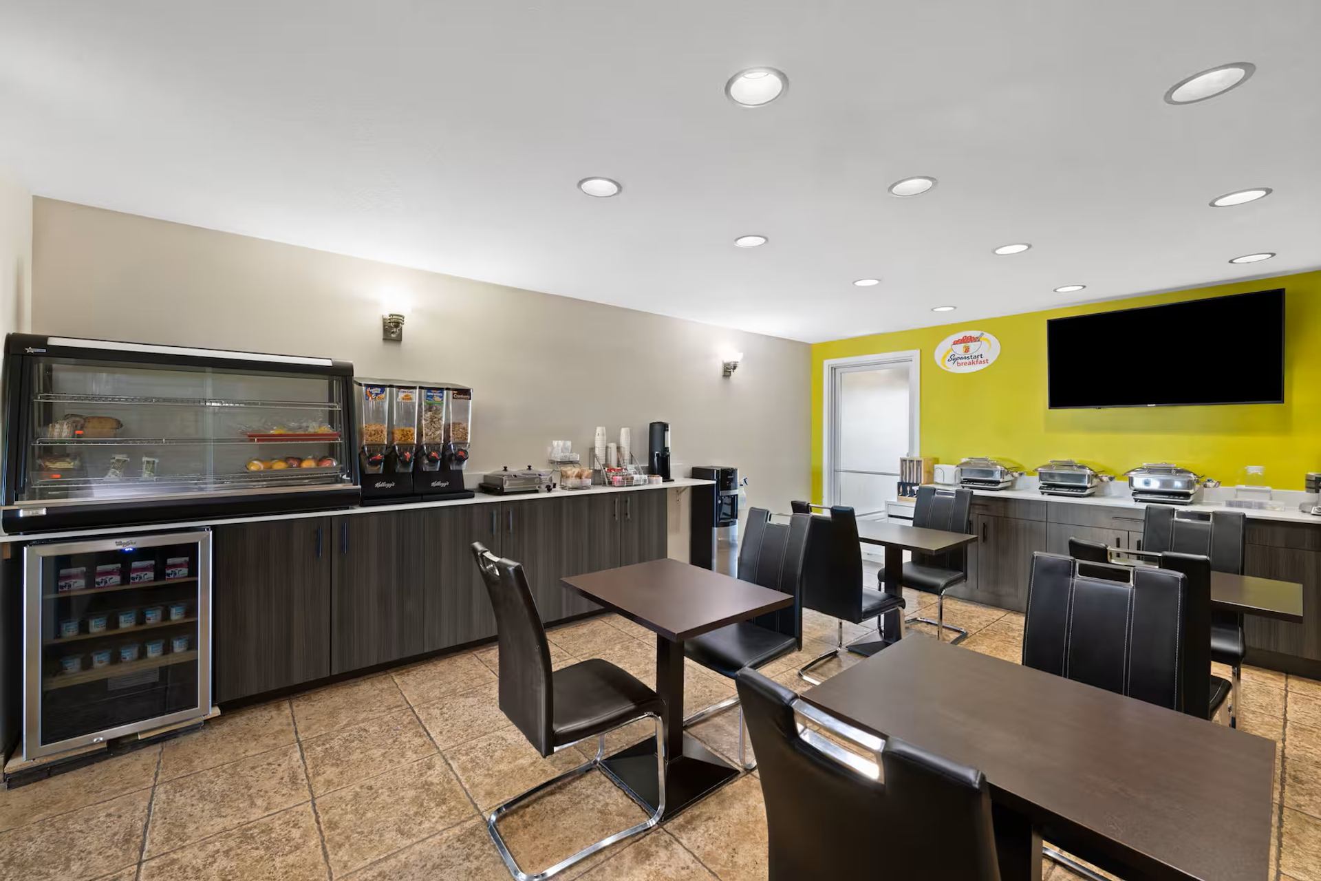 Super 8 by Wyndham Fort McMurray offers a bright breakfast area with seating and buffet options.