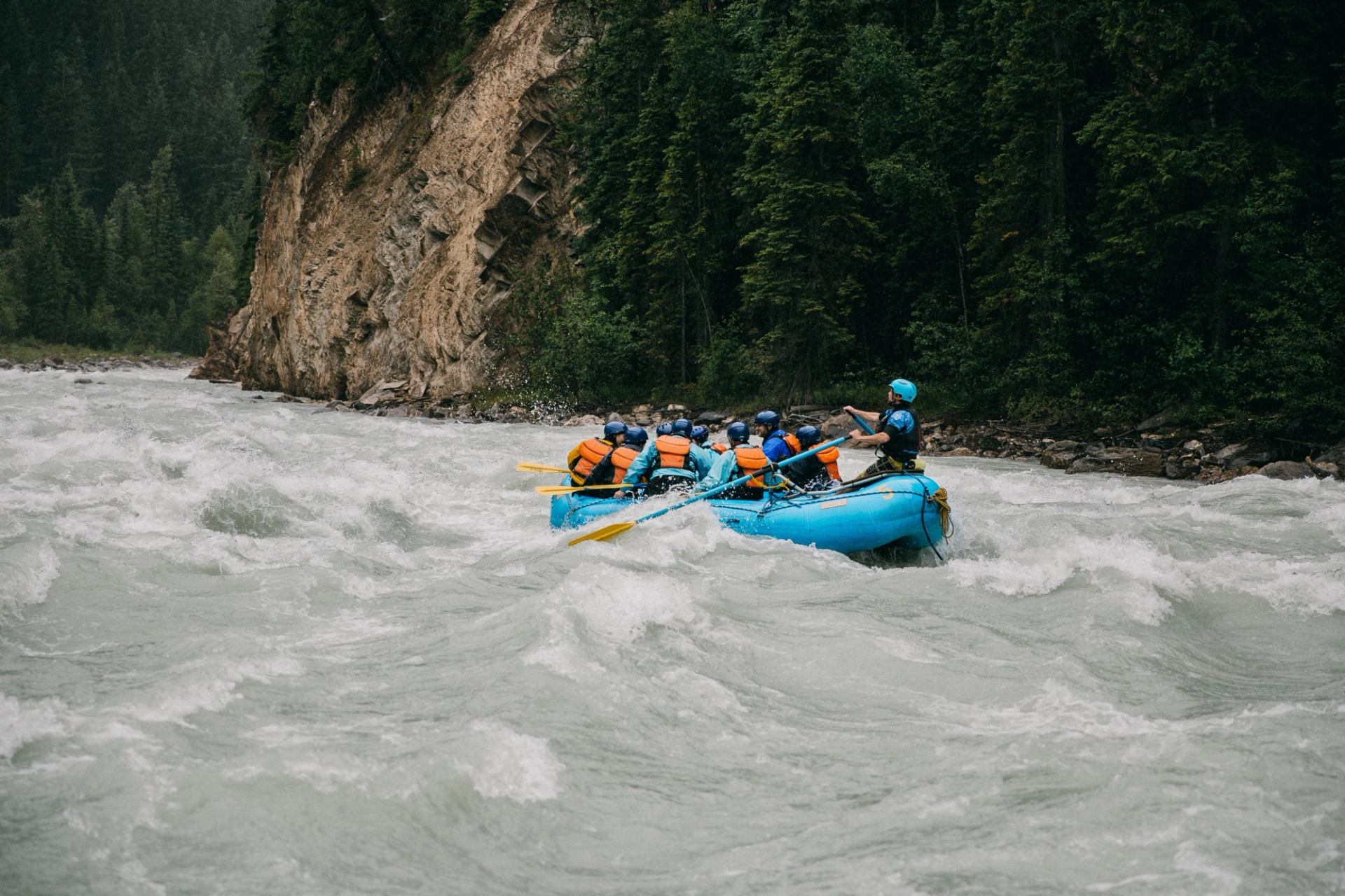 A group rafting all the rapids on the river.