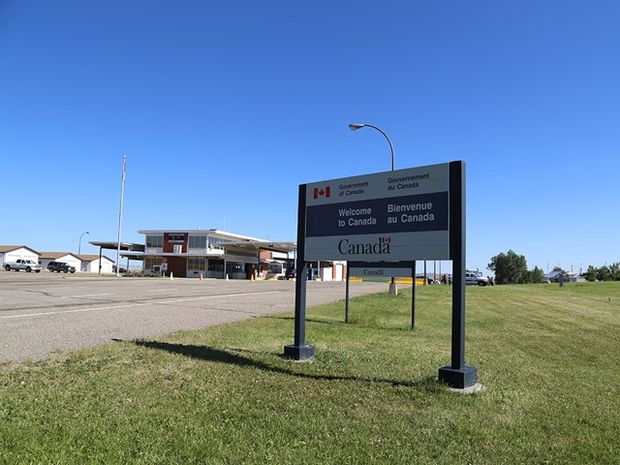 Exterior of Carway Highway/Land Border Office with sign in foreground.