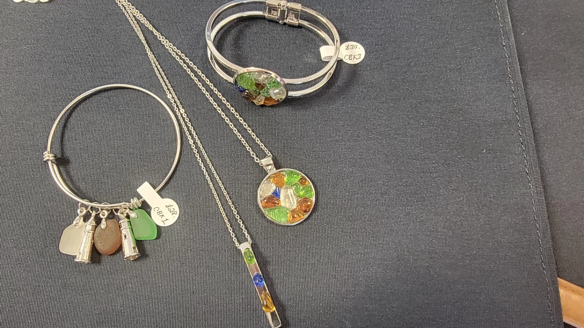 Coloured glass bracelets, necklaces, ear rings and pictures made with real sea glass. 