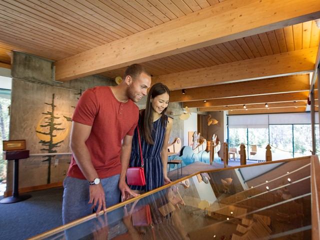 Visitors viewing historic artifacts at Fort George and Buckingham House exhibit.