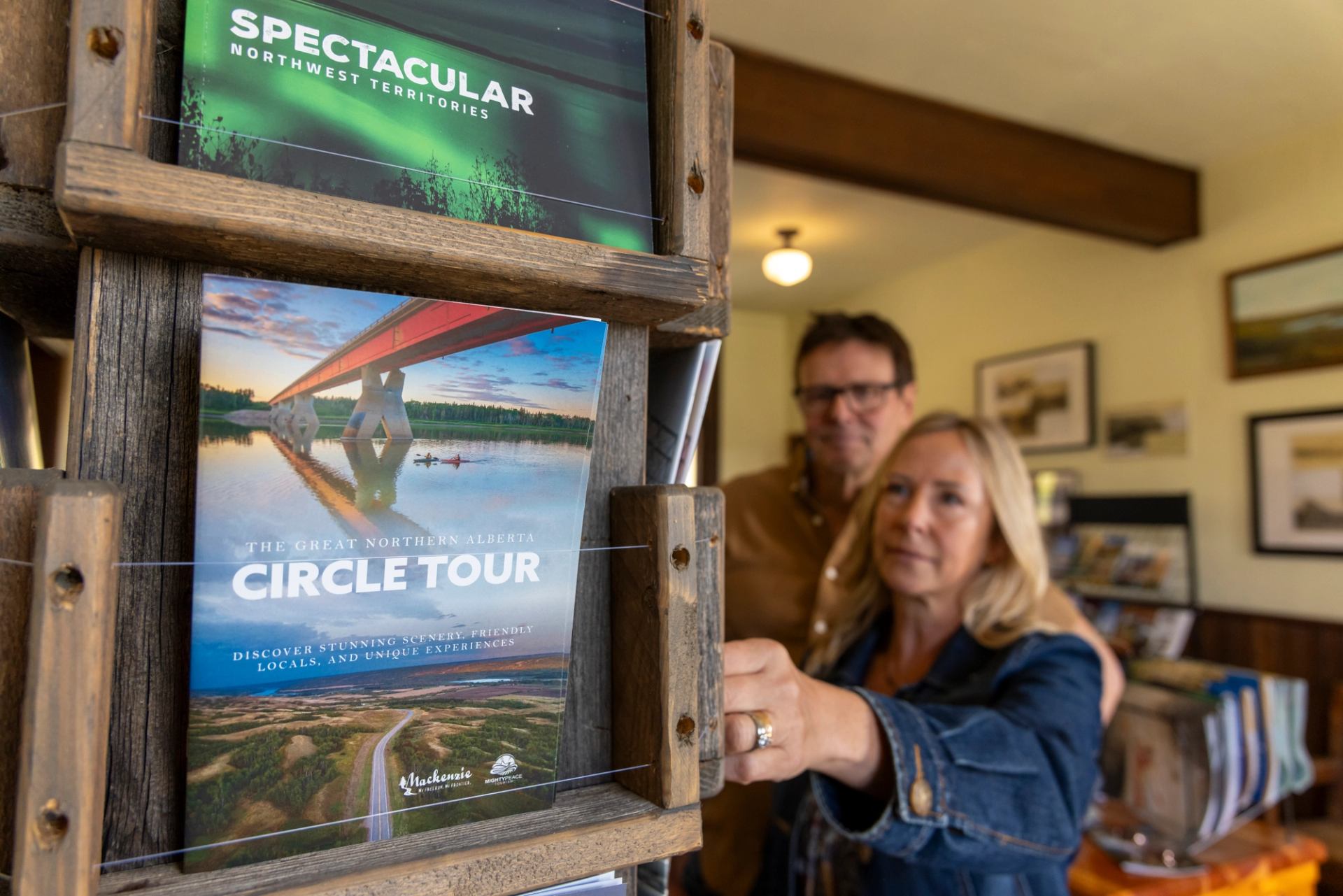 A couple look at brochures at the Peace River Northern Alberta Railway Station.